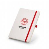 Vitt anteckningsblock med kontrastfärg på band.